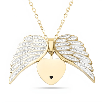 Gold heart pendant with angel wings, symbolizing love and protection, on chain by ORLA.