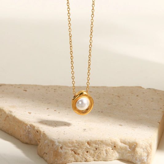 Close-up detail of genuine round pearl and stainless steel O-chain clasp on elegant pearl pendant necklace by Orla Jewelry Store
