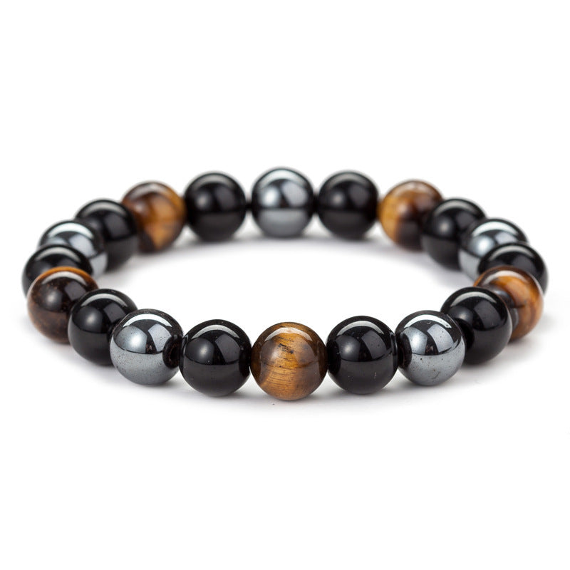 The Grounded One bracelet by ORL'A Jewelry Store, featuring Tiger Eye and Black Stones, displayed on white background for clarity and protection