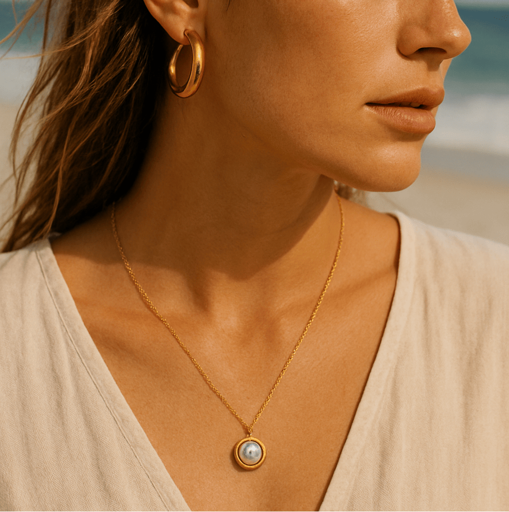Close-up of Orla Jewelry Store pearl pendant necklace worn by model — elegant single pendant styled for a minimalist look
