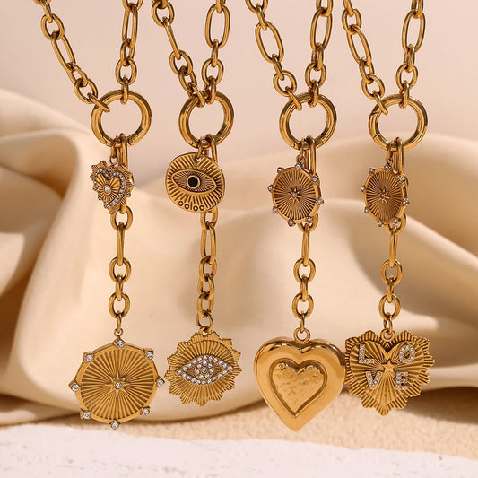 Close-up of ORLA’s 18K gold tassel pendant with star and heart details
